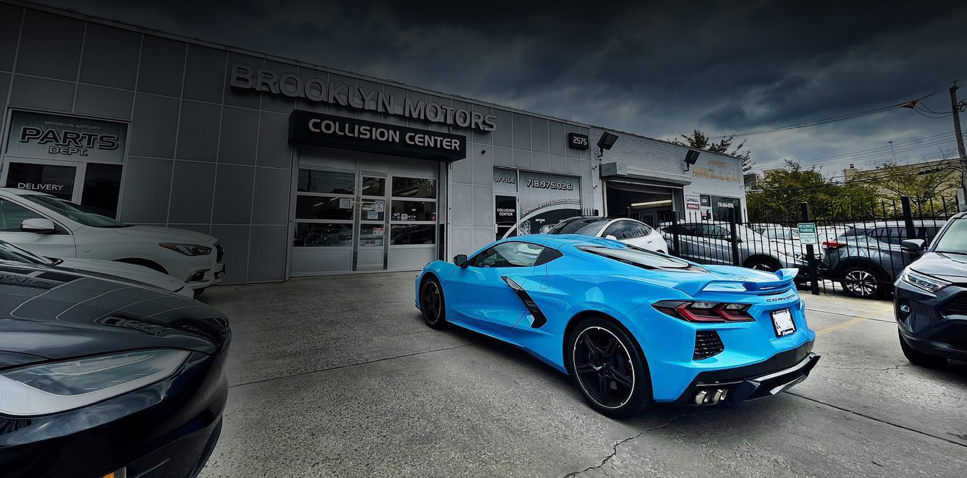 Blue sports car outside the Brooklyn Motors collision center