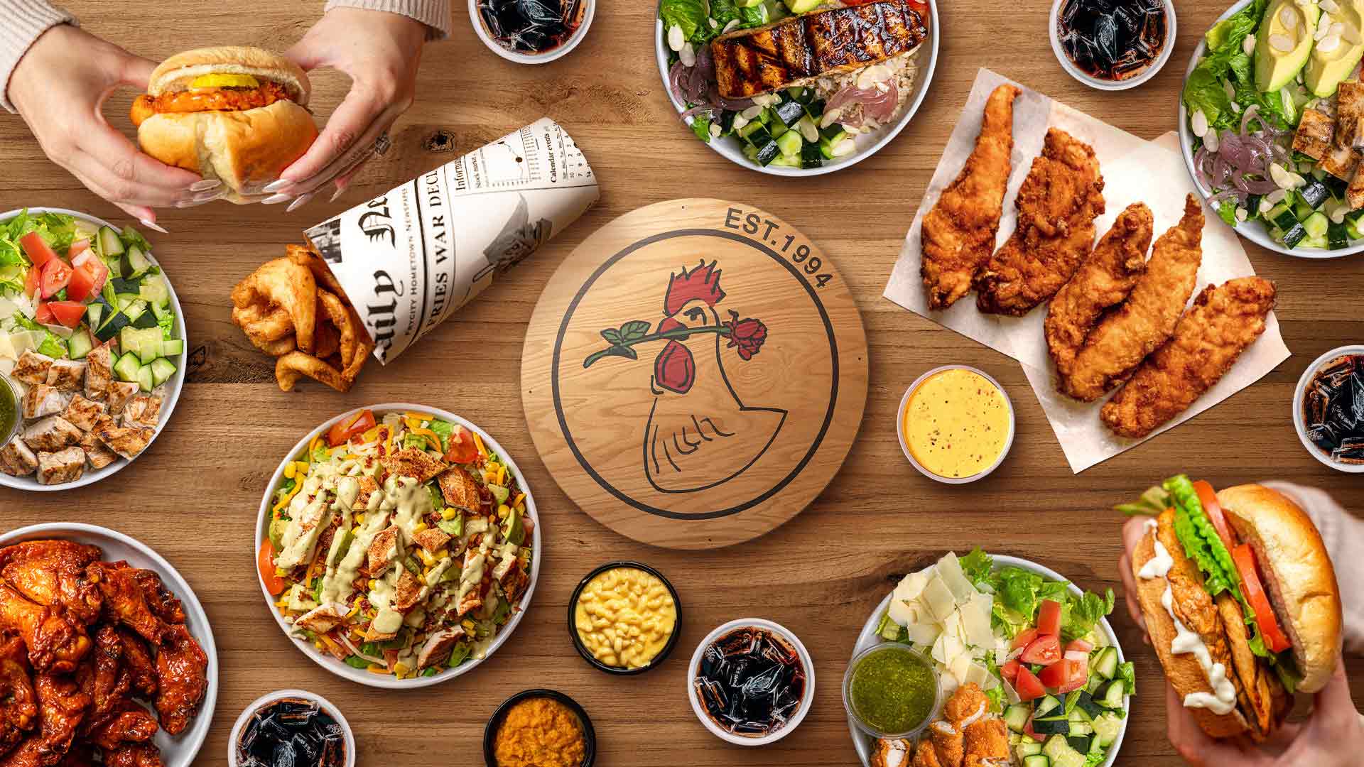 La Rosa Chicken and Grill food spread with its logo at the center