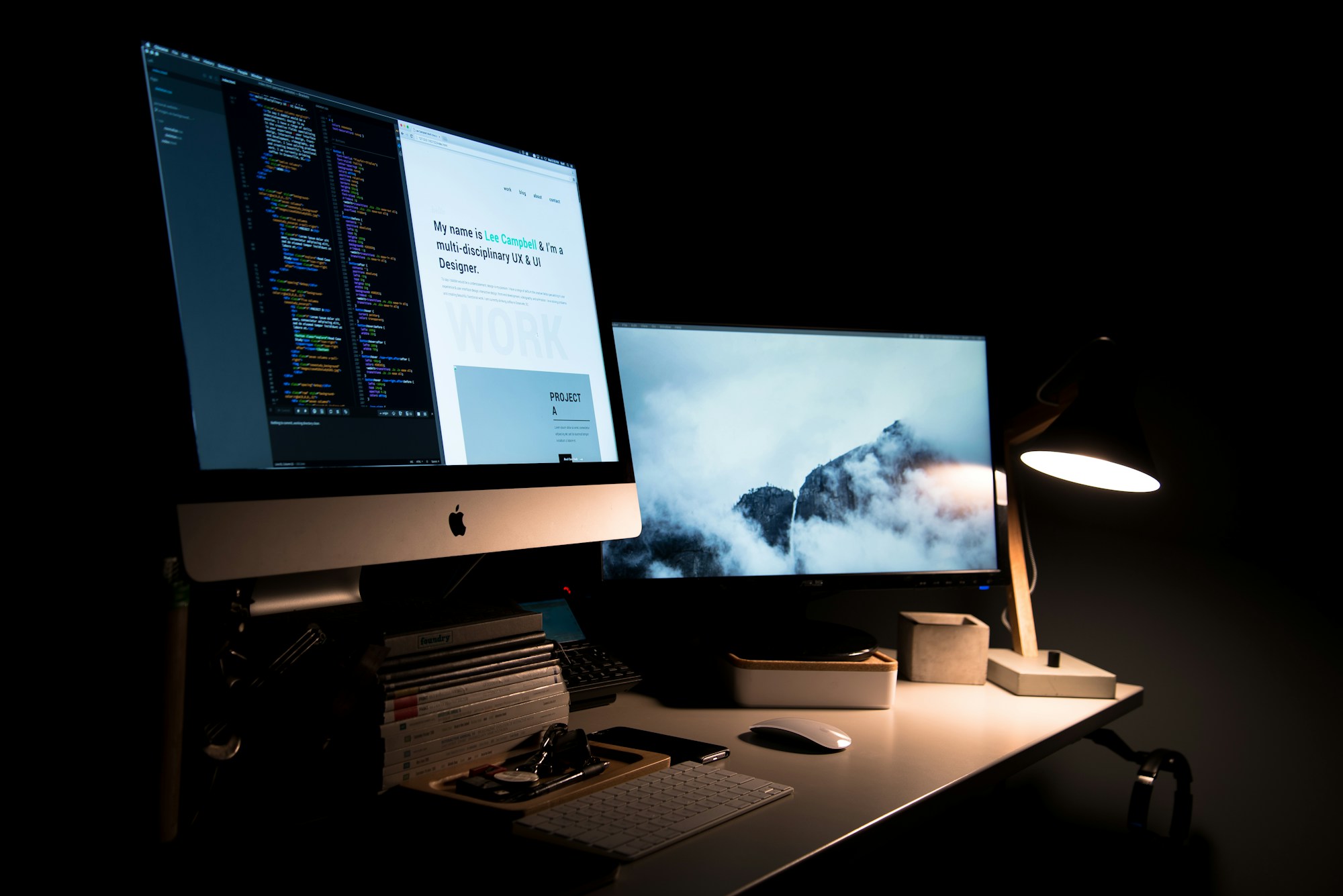 A web development workstation with a website and code on screen