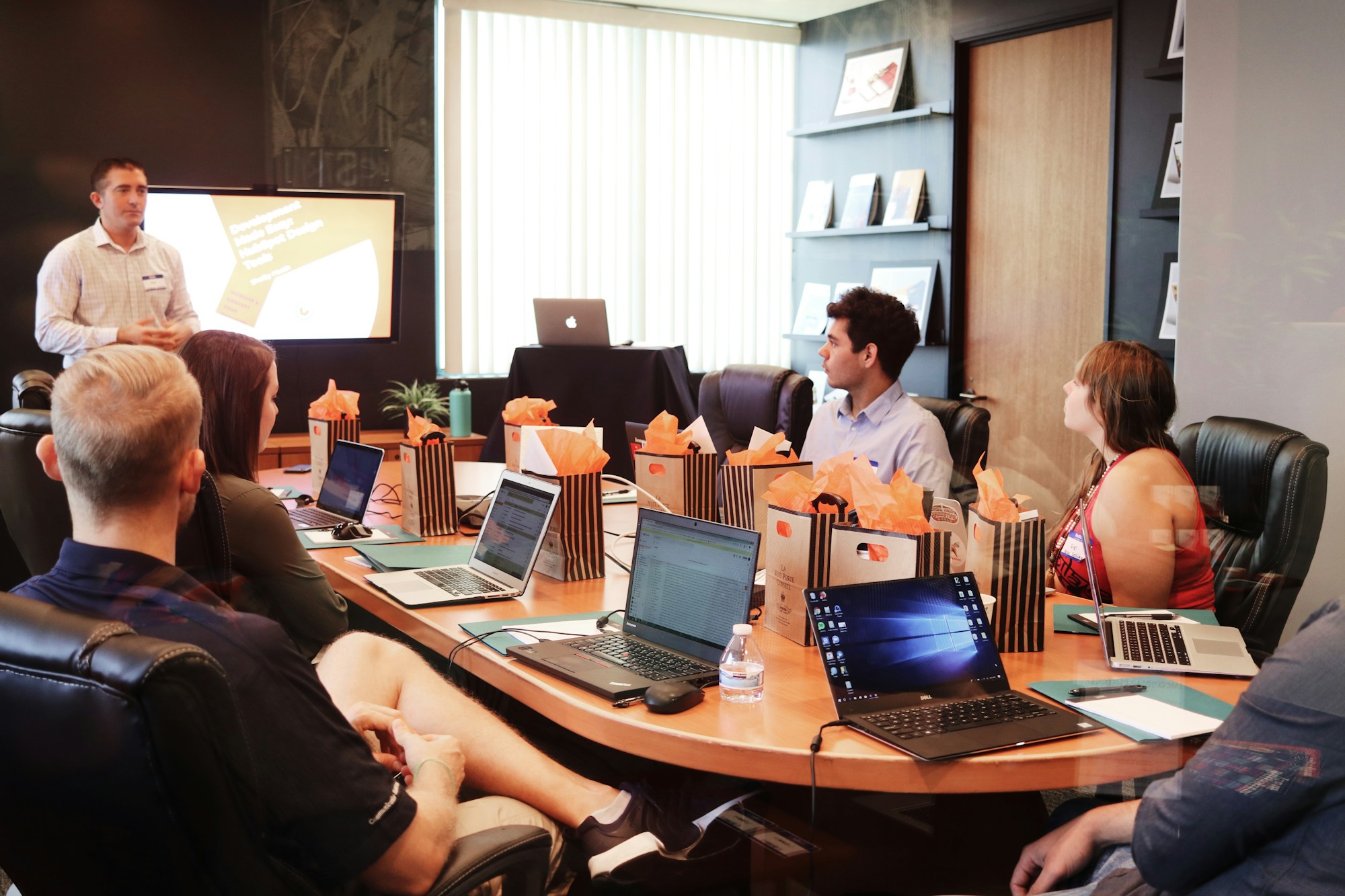 A business team meeting around a conference table